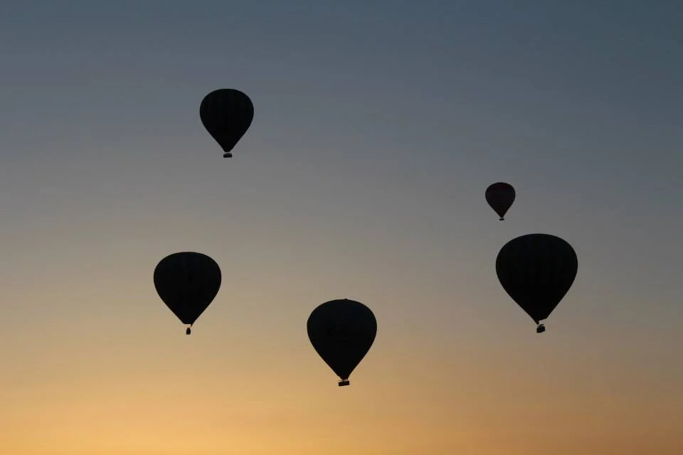 Hot air balloons at sunrise. 