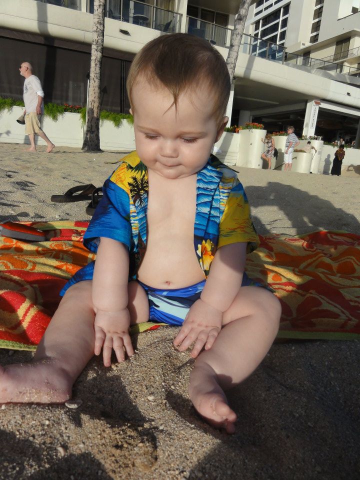 Wells loved to just sit and play in the sand