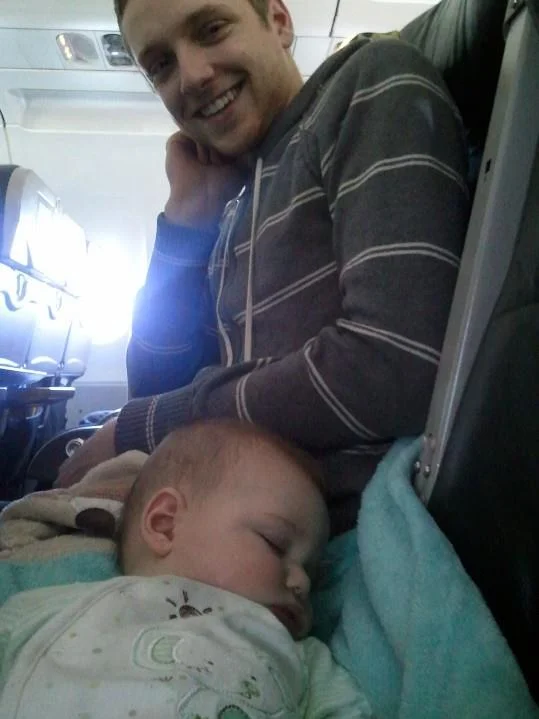 Baby Wells sleeping on daddy on one of his many plane rides.